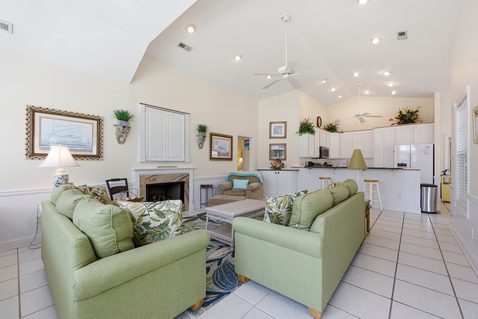 Settle into the cozy living room with vaulted ceilings and coastal touches, or whip up a meal in the fully-equipped kitchen—your home away from home awaits.