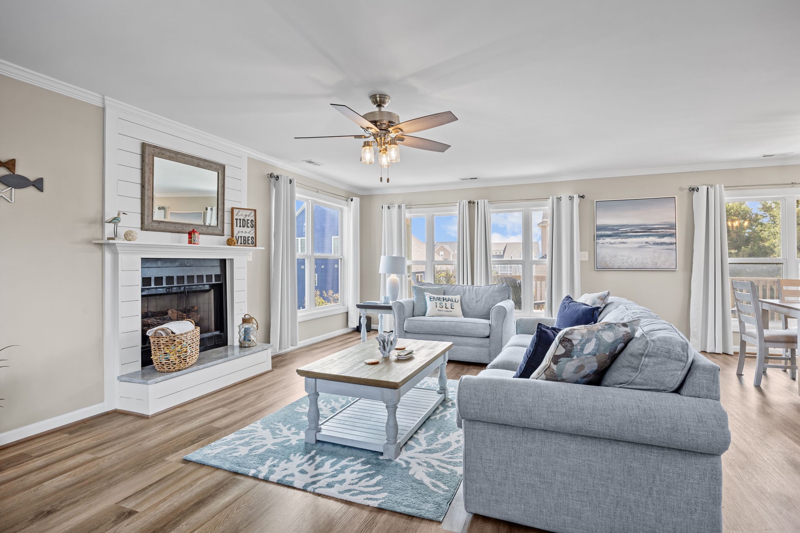 Sink into plush sofas by your cozy fireplace while natural light streams through multiple windows, creating the perfect retreat.