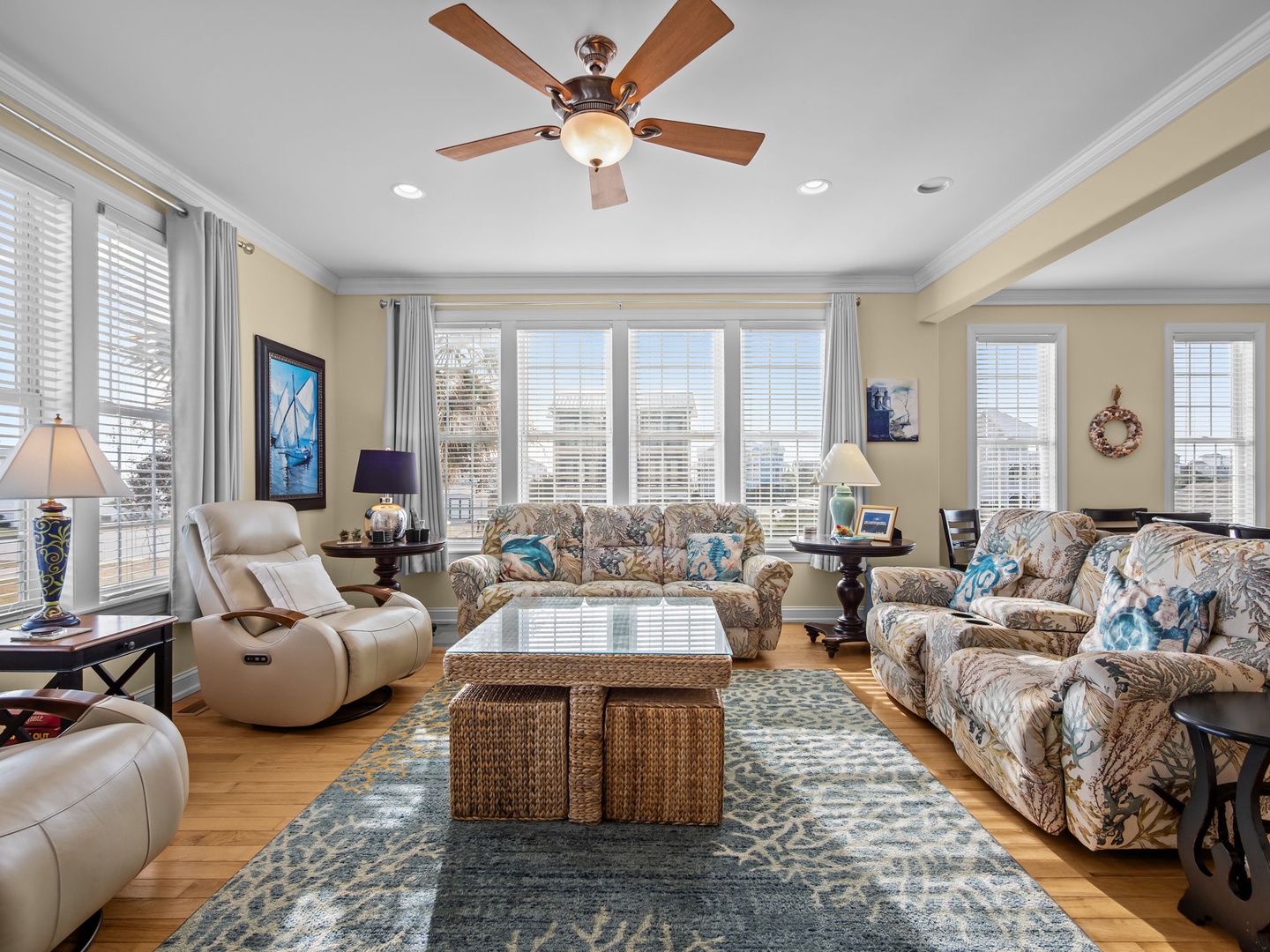 Relax in your spacious living room with panoramic city views, comfortable seating, and elegant coastal decor that makes you feel right at home.