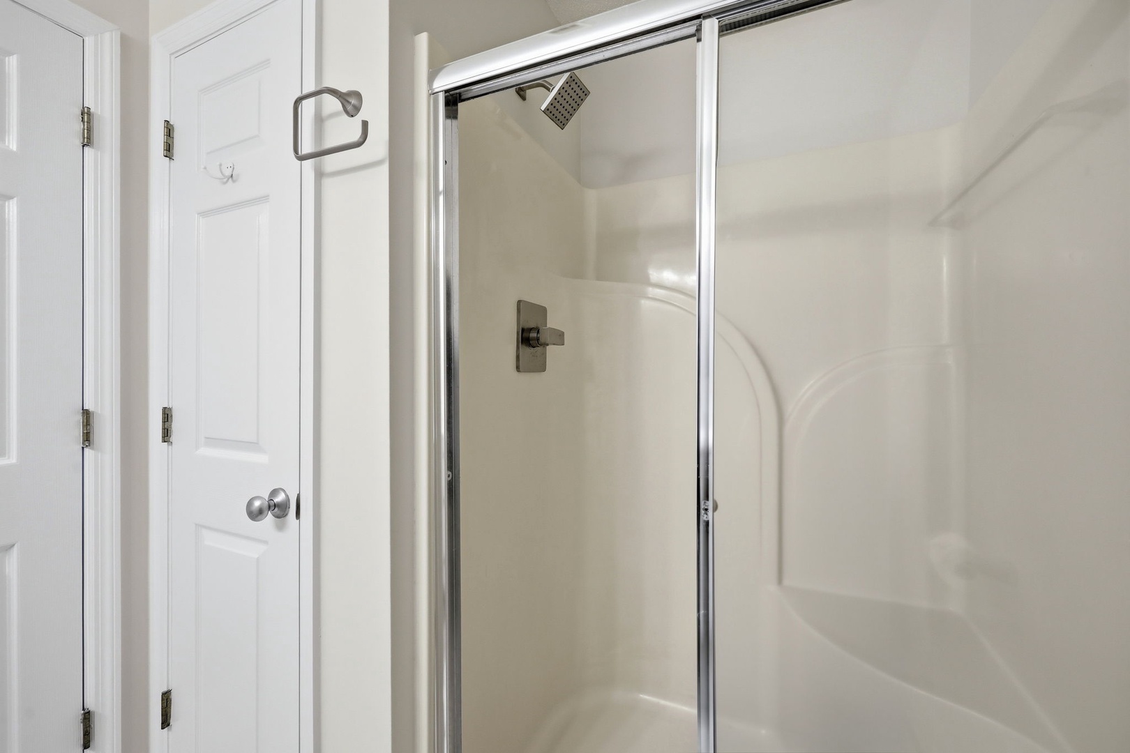 Step into your private shower with a sleek glass enclosure and modern fixtures, perfect for refreshing after a day of adventure.