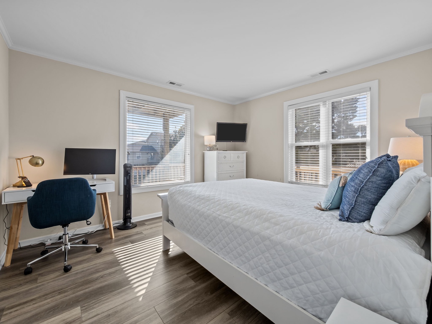 You'll love this bright bedroom with a comfy queen bed, workspace desk, and streaming-ready TV for ultimate relaxation.