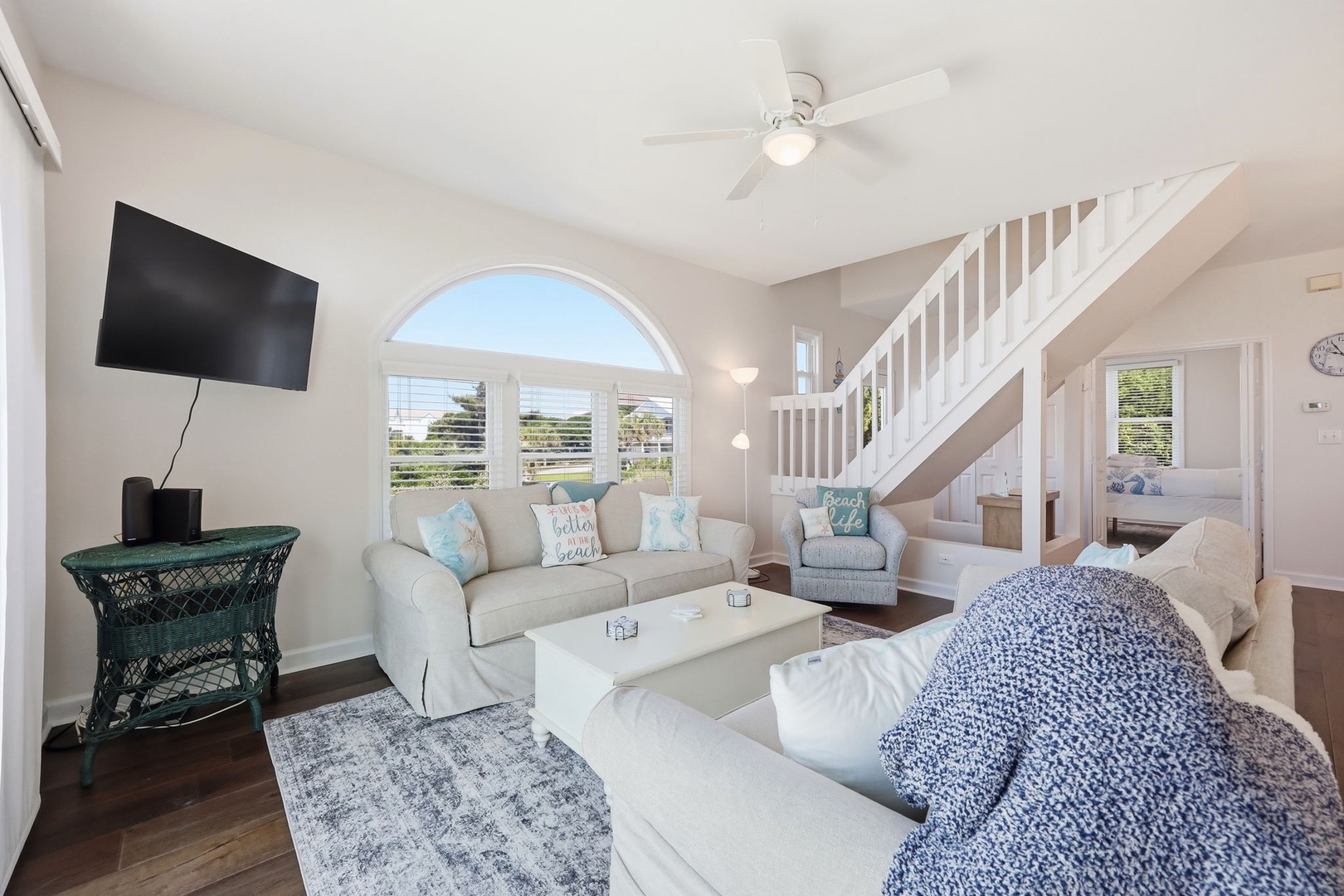 Settle into your bright coastal retreat with plush seating, ocean-inspired touches, and a breezy open layout perfect for unwinding after beach days.