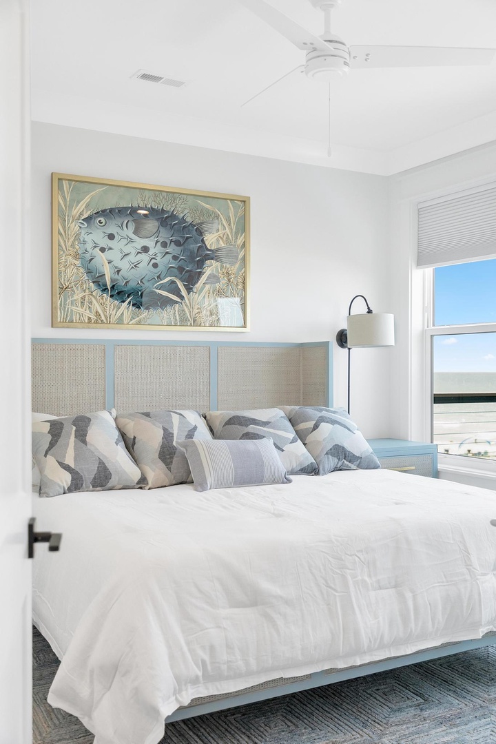 Drift off in this airy coastal bedroom, where ocean-inspired art and soft linens create your perfect seaside sanctuary.