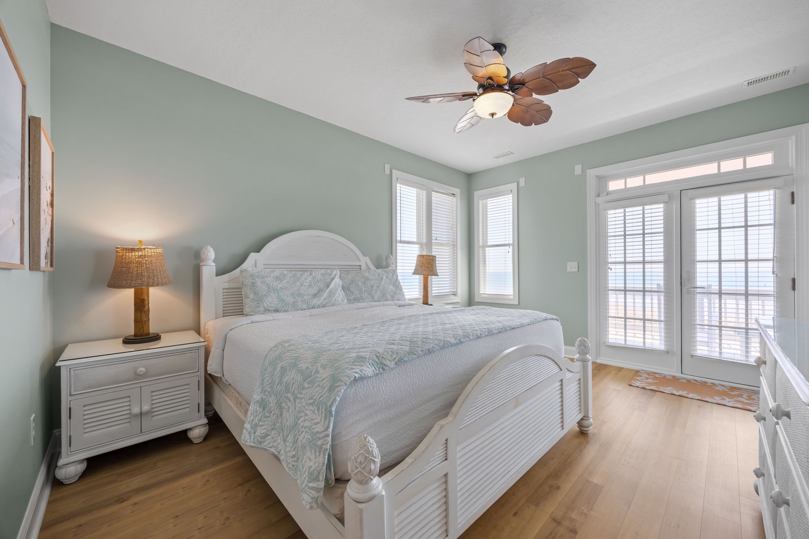 Drift into peaceful sleep in your coastal bedroom with tropical ceiling fan and French doors opening to your private balcony.