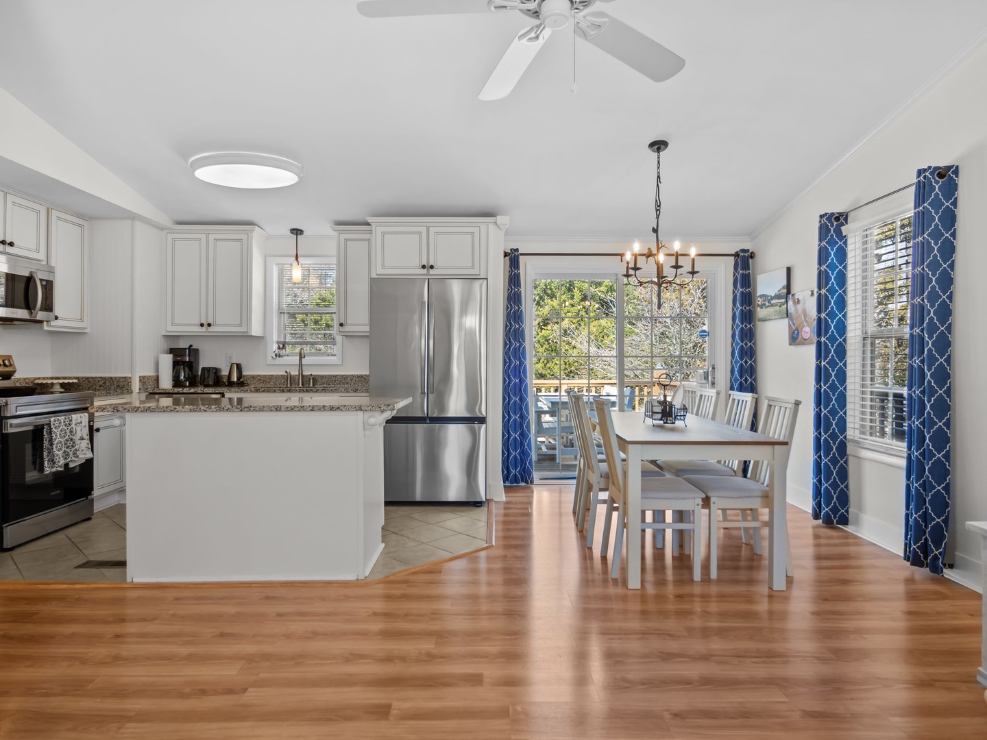 Gather around your spacious open kitchen and dining area, where stainless steel appliances and warm hardwood floors create the perfect space for memorable meals.