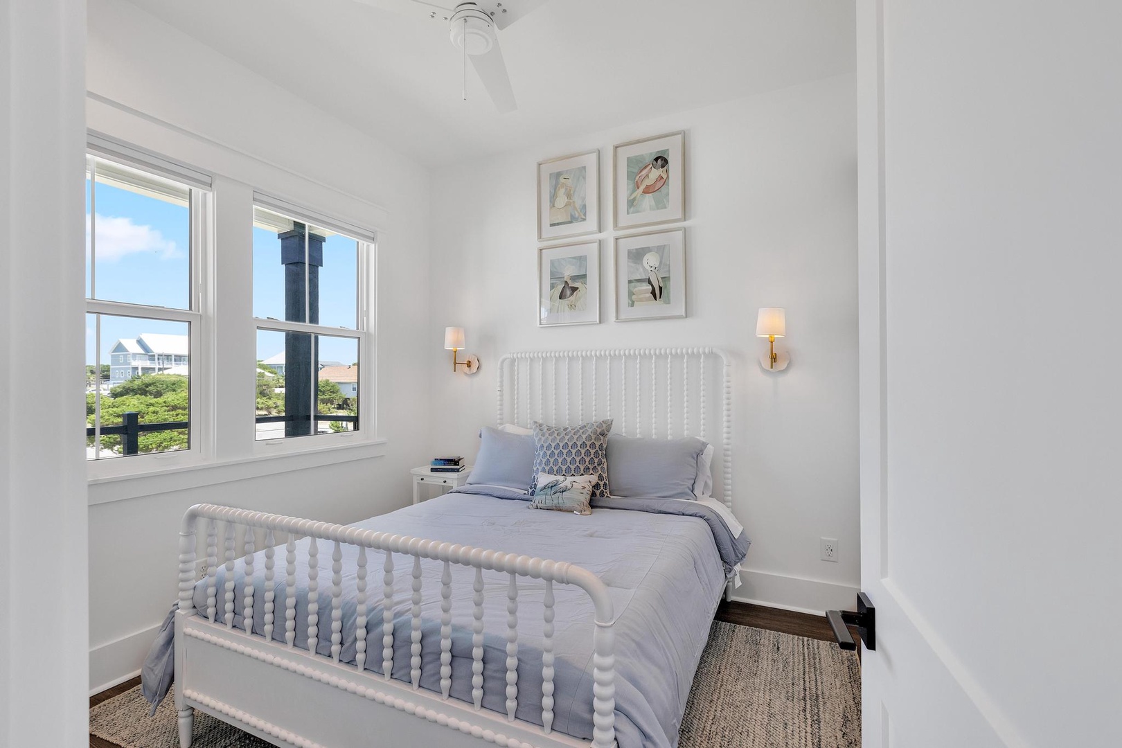 Unwind in your serene coastal bedroom, where soft linens and gentle breezes through bright windows create your perfect beachside retreat.
