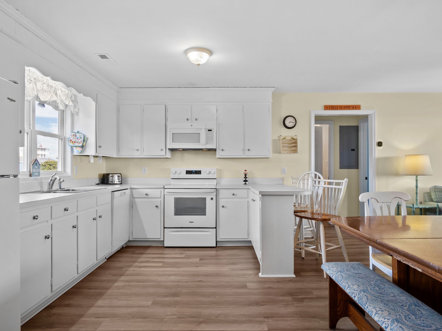 Your bright kitchen welcomes you with white cabinets, modern appliances, and plenty of counter space for cooking memorable meals together.