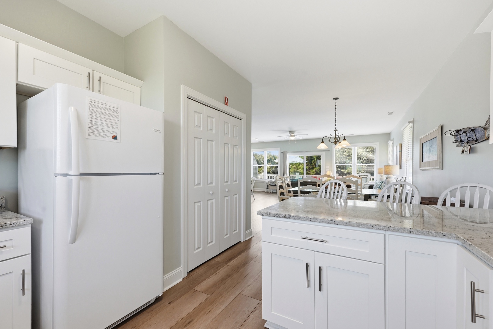 Your bright, fully-equipped kitchen flows into a sunlit dining and living area, perfect for gathering after a day of exploring or unwinding with morning coffee and views.