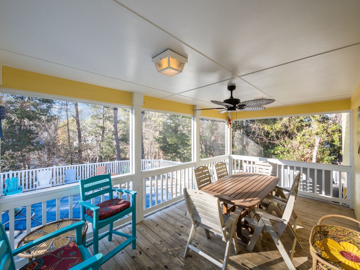 Your screened porch offers peaceful dining with pool views, ceiling fan comfort, and charming outdoor furniture for memorable meals.