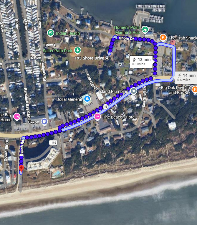 Aerial view of a coastal neighborhood with walking routes to nearby marina, shops, and beach access along Shore Drive.