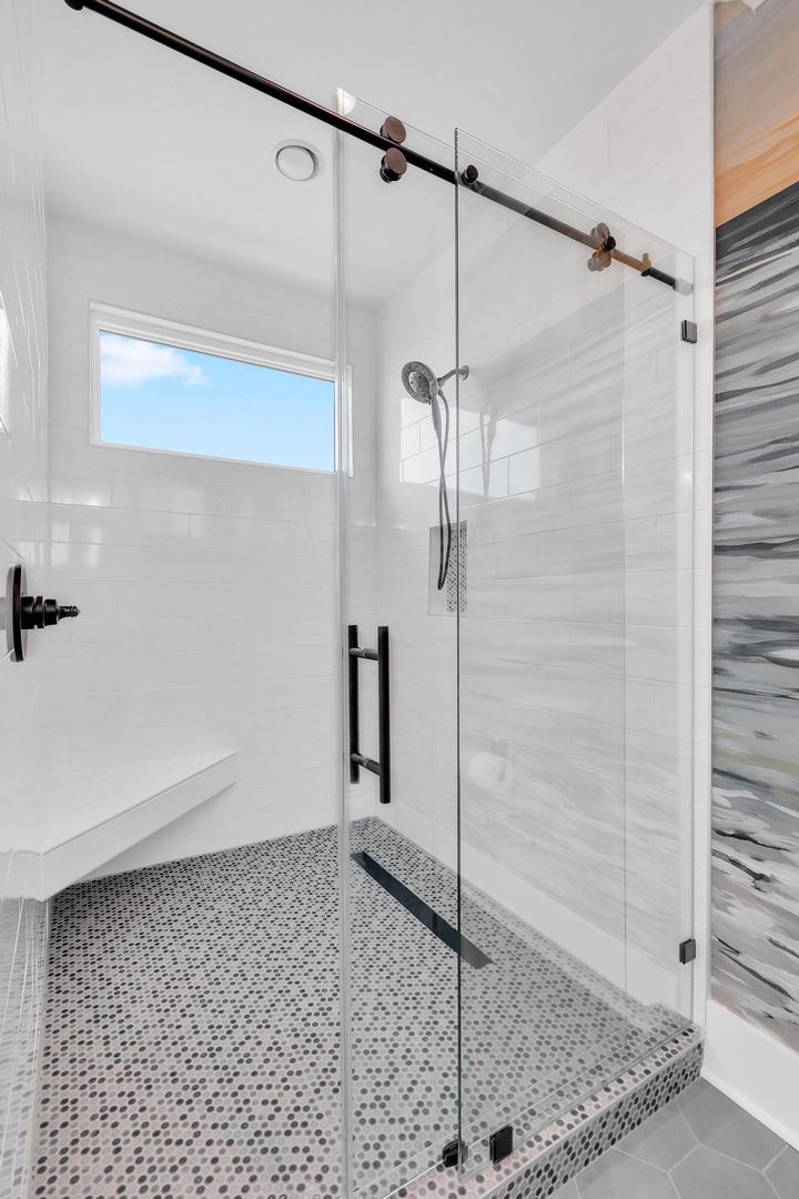 Step into your stylish glass-enclosed walk-in shower with modern fixtures and contemporary tile work that creates a spa-like atmosphere for your daily refresh.