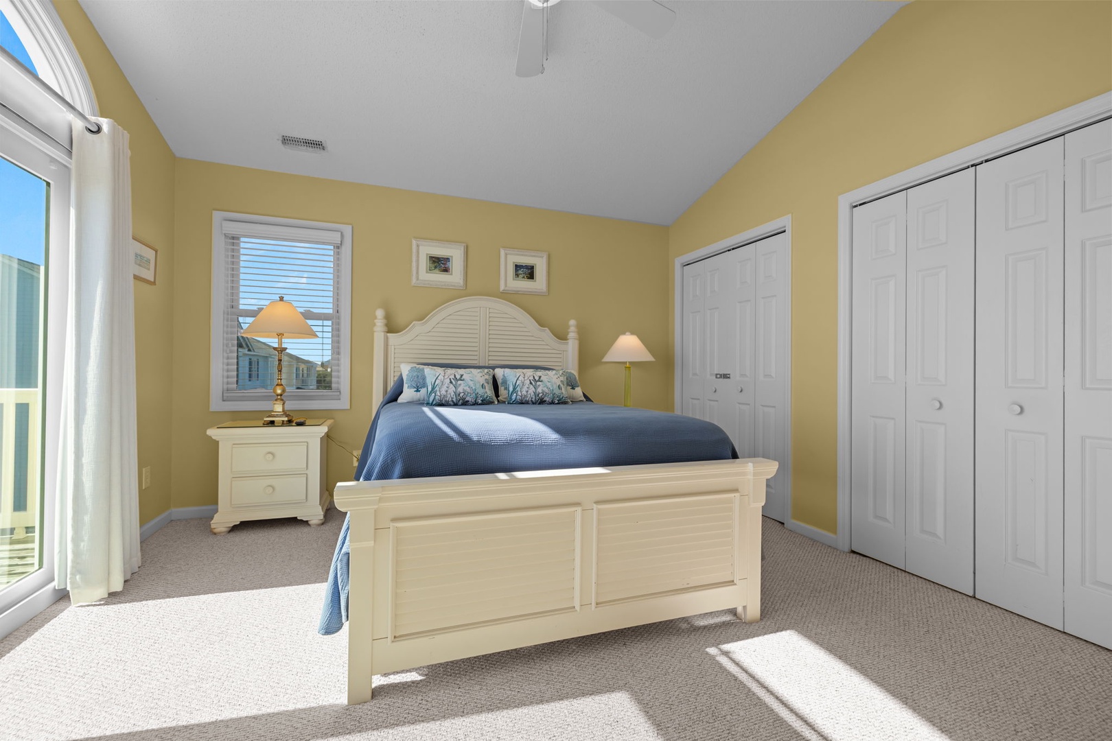 Unwind in your sunny bedroom with coastal charm—soft linens, warm lighting, and peaceful views create the perfect retreat.