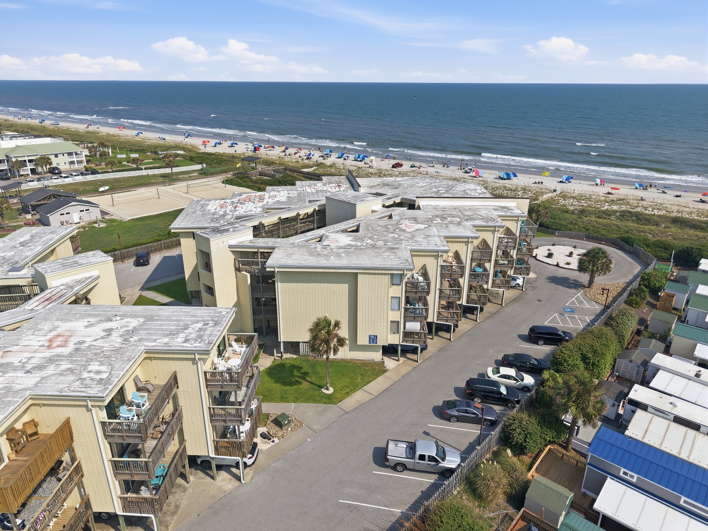 Char’s Cozy Condo | Building and Nearby Beach