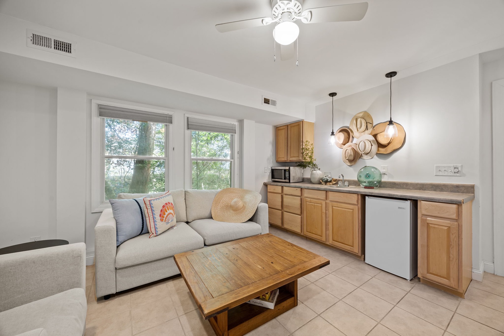 Relax in your bright, open living space where warm wood tones meet modern comfort, perfect for unwinding after exploring.