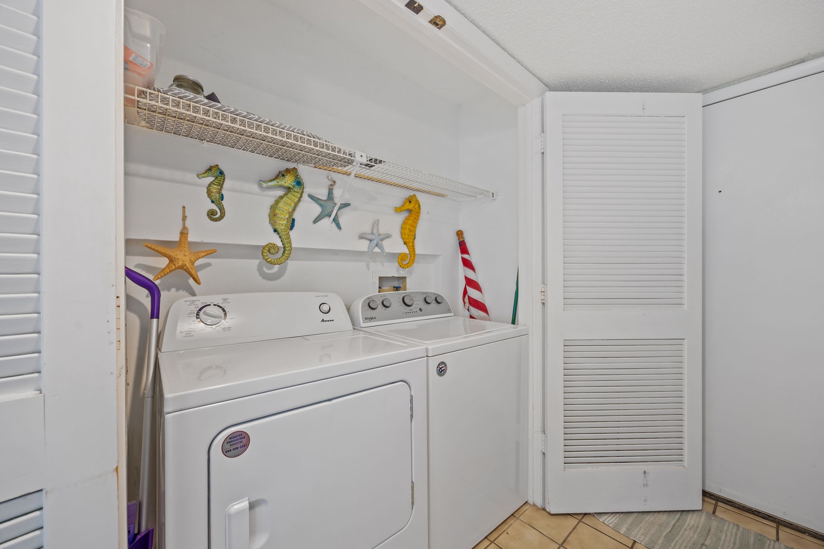 Your private laundry space makes beach trips worry-free with whimsical seahorse decor brightening wash day.