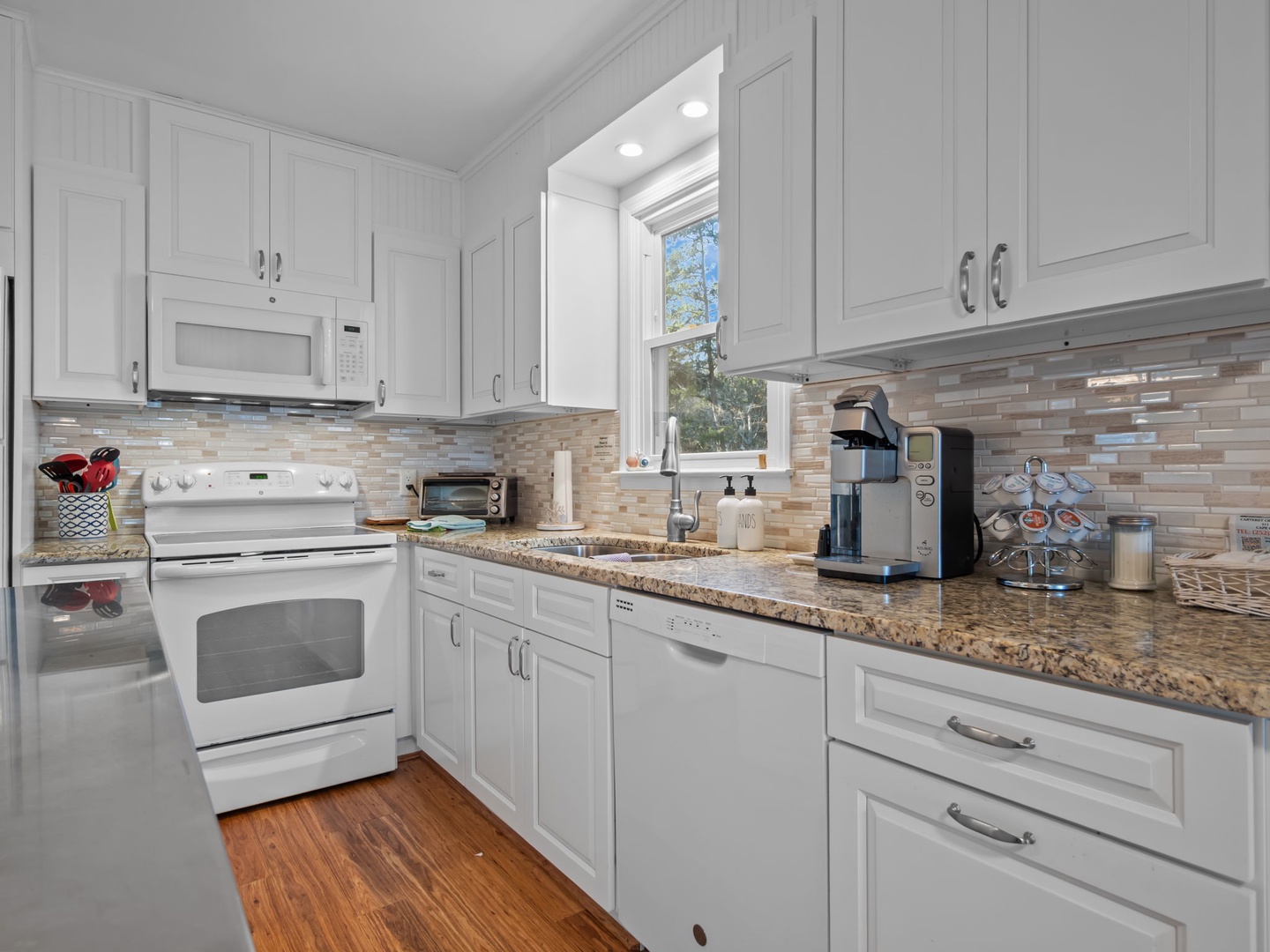 Your fully equipped kitchen features granite counters, modern appliances, and everything you need to create memorable meals during your stay.