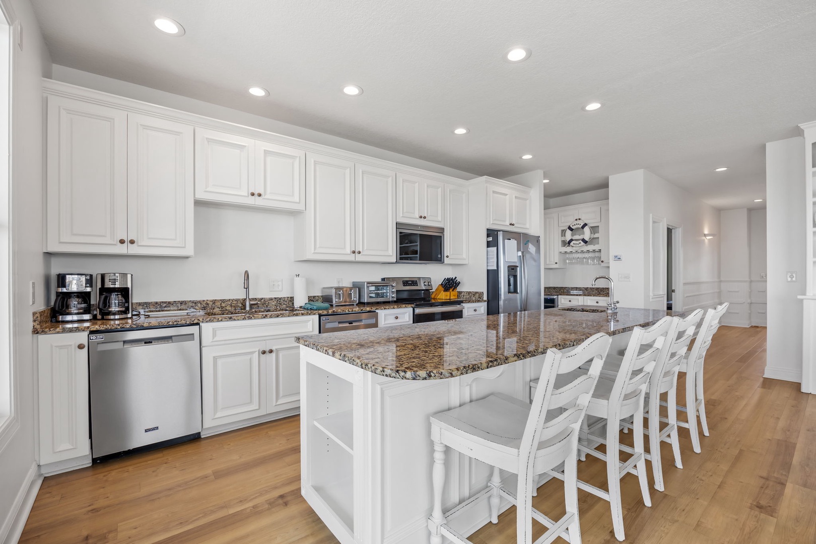 Your gourmet kitchen awaits with granite countertops, stainless appliances, and a spacious island for cooking and gathering together.