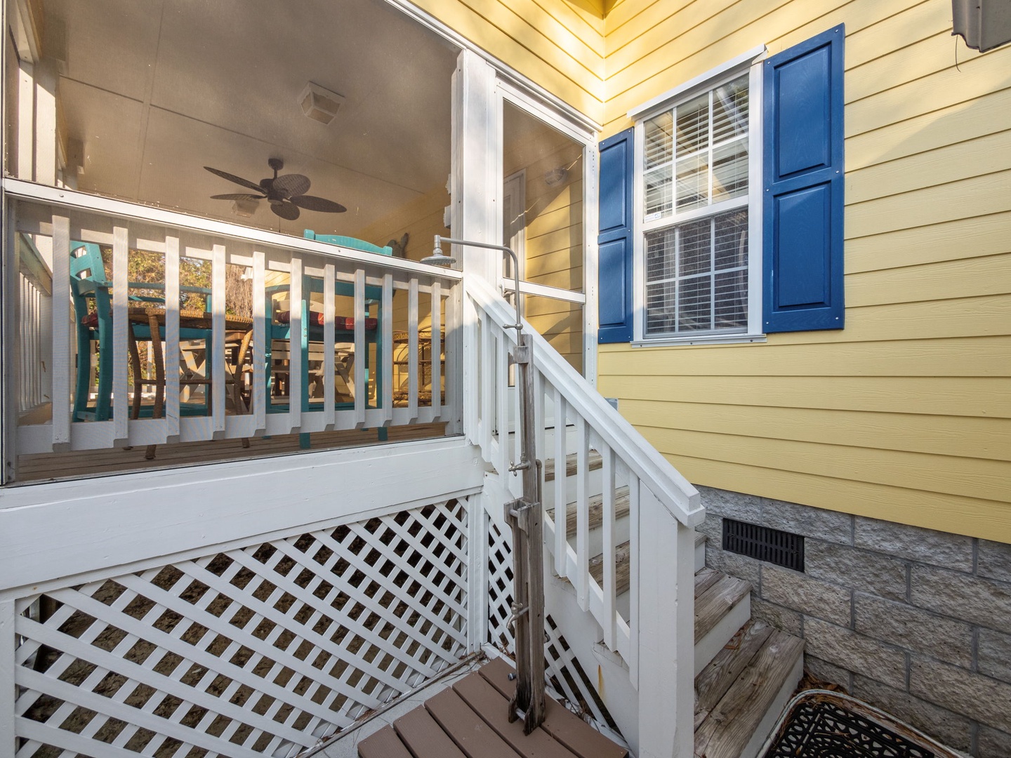 Relax on your private covered balcony with ceiling fan and charming blue shutters, perfect for morning coffee or evening unwinding.