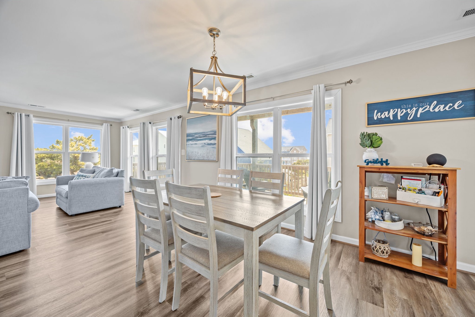 Gather around your spacious dining table for memorable meals while enjoying panoramic views through floor-to-ceiling windows.