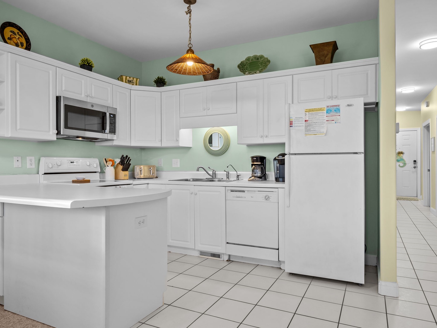 Your fully equipped kitchen awaits with everything you need to whip up delicious vacation meals in this bright, welcoming space.