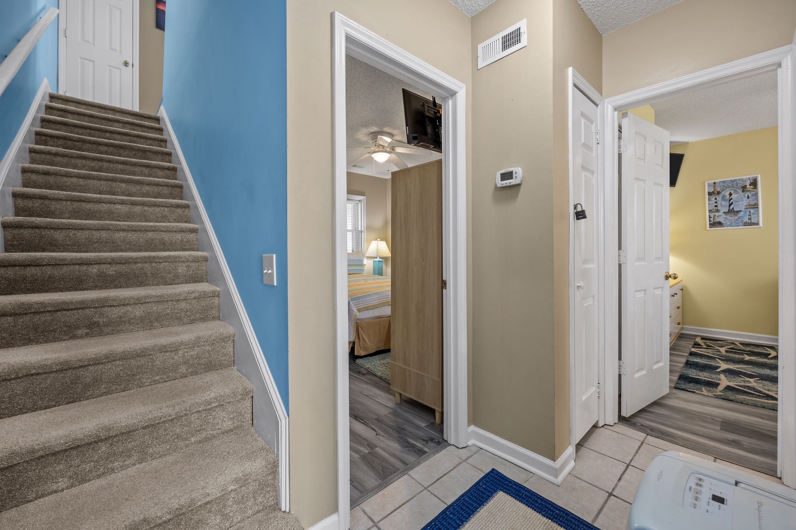 Step into your welcoming entryway where thoughtful touches and open sightlines create an inviting sense of home from the moment you arrive.