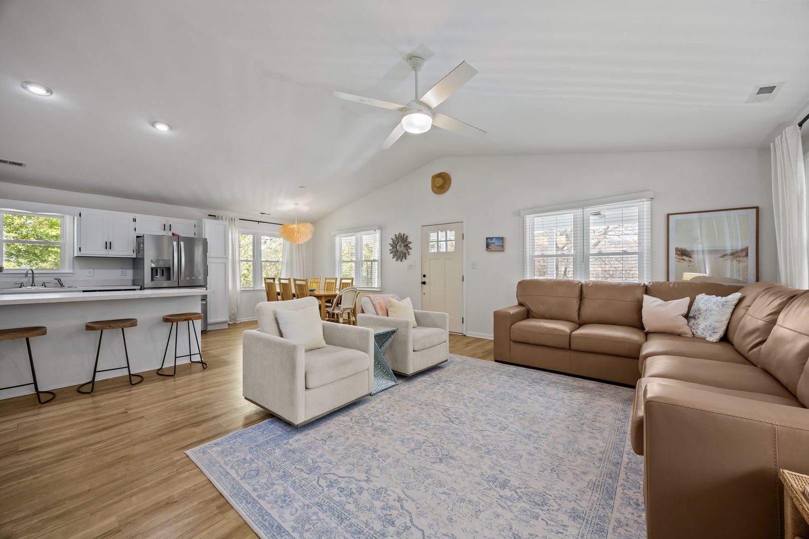 Unwind in this bright, open living space where soft leather seating and modern kitchen create the perfect backdrop for memorable gatherings.