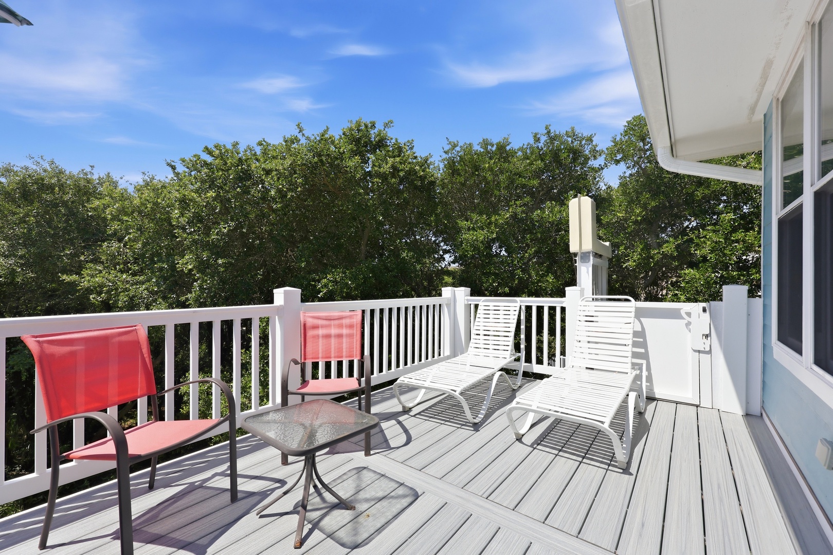 Picture yourself lounging in these comfy chairs, sipping your morning coffee while breathing in the fresh air and taking in lush treetop views from your private deck.