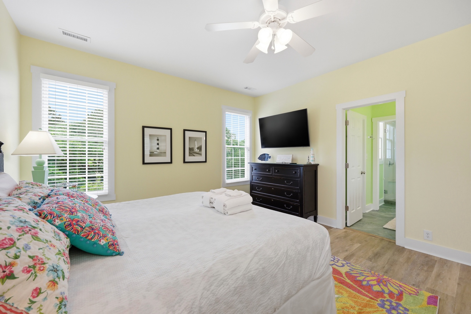 Unwind in your sunny bedroom, complete with fresh linens, a flat-screen TV, and a bright en-suite bathroom—your perfect retreat after a day of adventure.