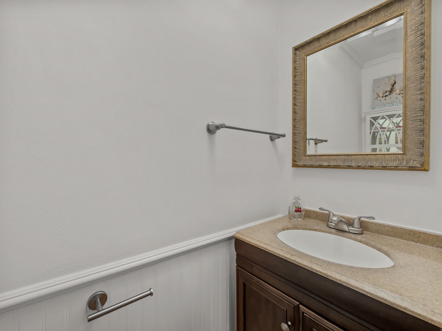 Your private powder room features thoughtful details like grab bars for safety and a convenient vanity area.