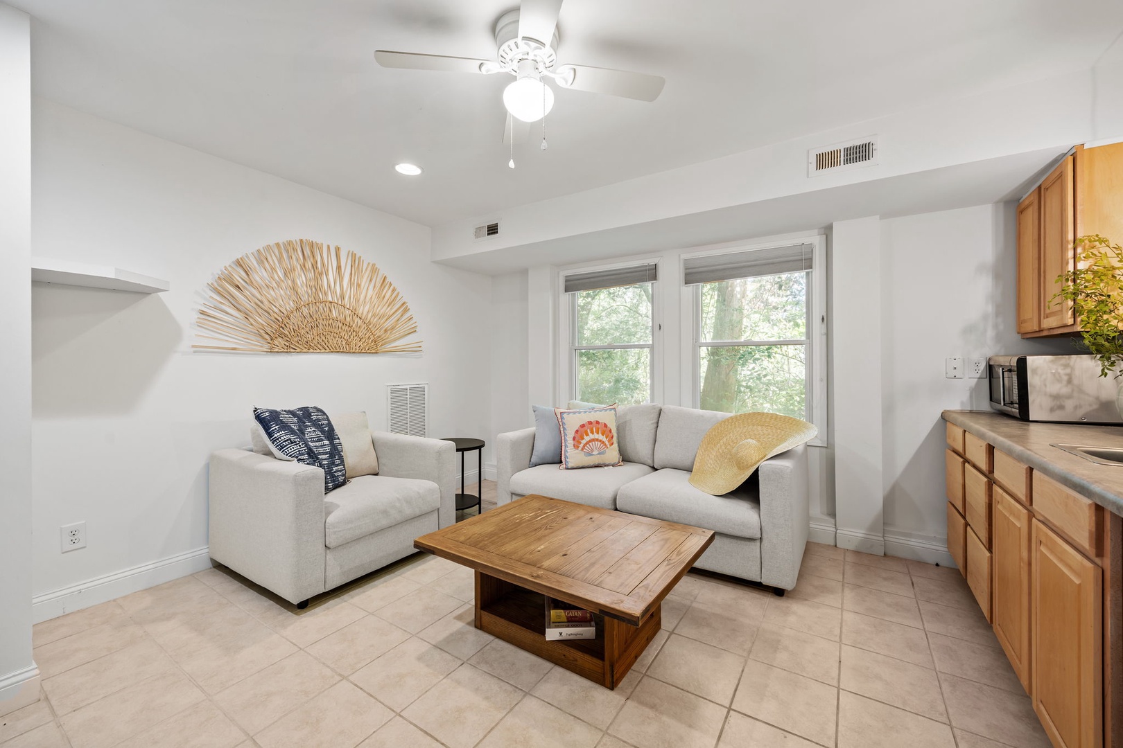 Unwind in your bright living space with plush seating, natural light streaming through large windows, and stylish touches creating the perfect retreat atmosphere.