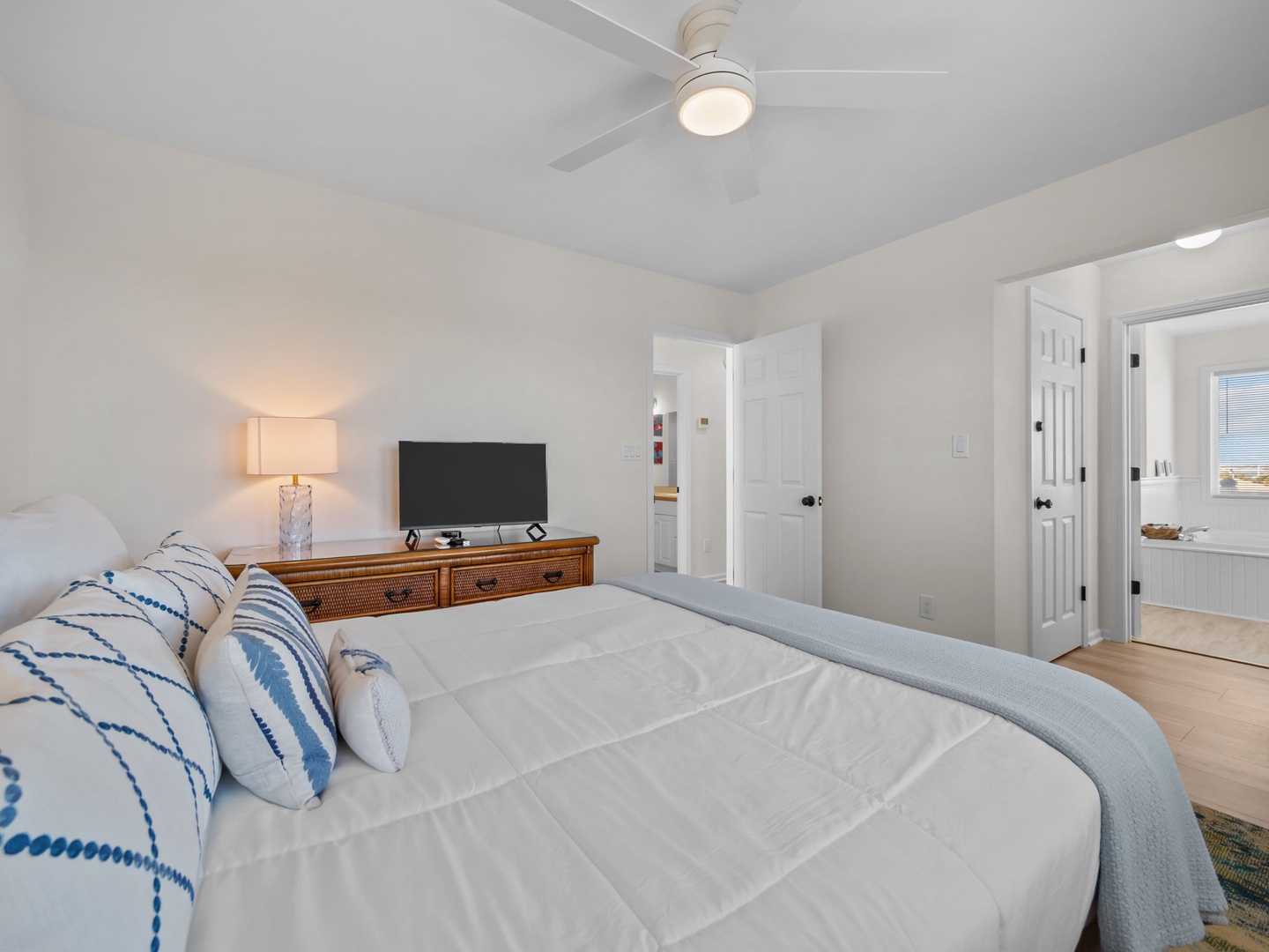 Rest peacefully in your serene bedroom with crisp linens, gentle lighting, and thoughtful coastal touches.