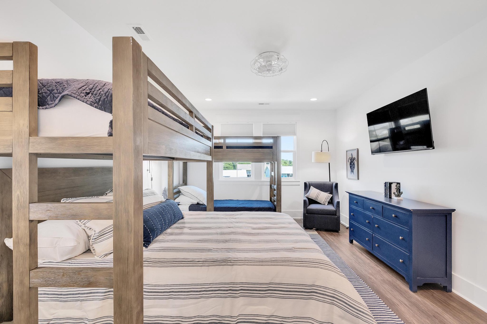Two sets of bunk beds create a cozy space for your whole crew to rest after a day of adventure. The bright, modern design and wall-mounted TV make it fun and comfortable.