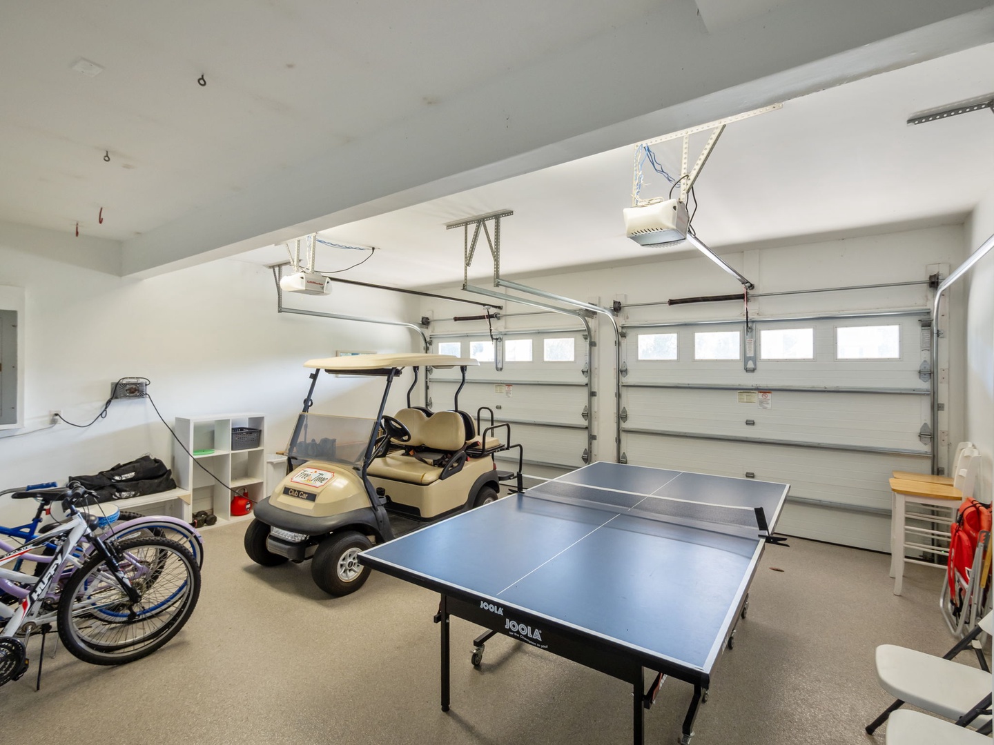 Garage with Golf Cart and Ping Pong Table