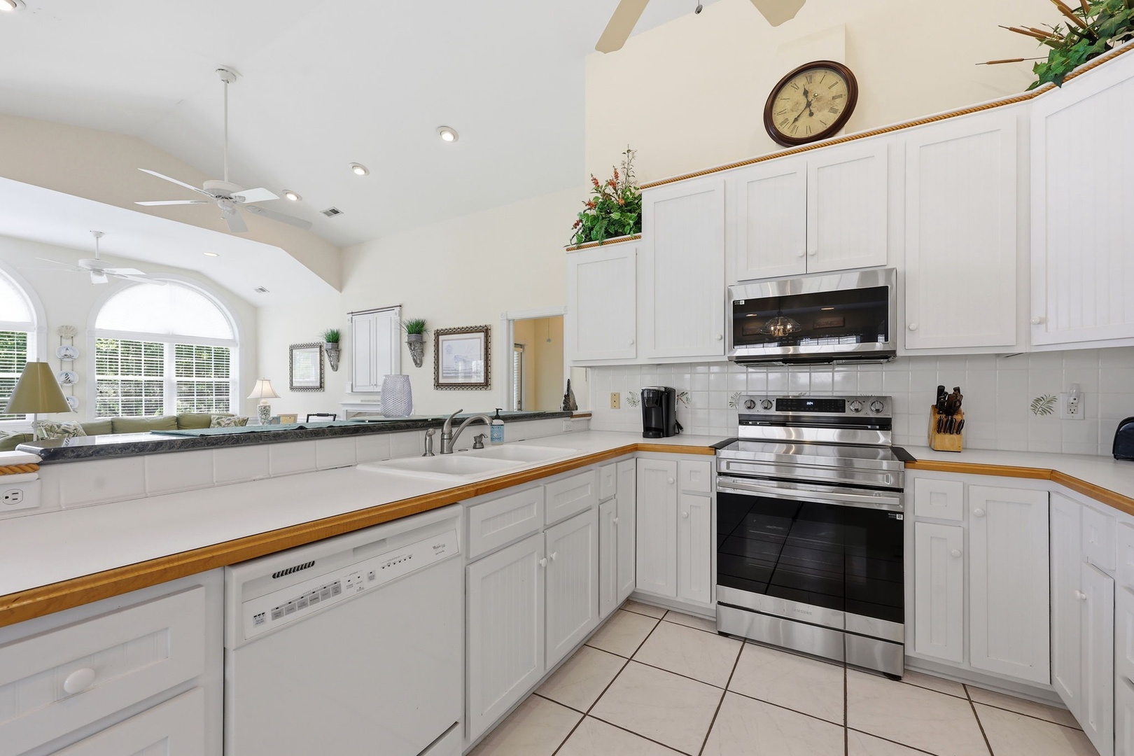 Step into your fully-equipped kitchen with ample counter space, modern appliances, and bright natural light—perfect for preparing your favorite meals during your stay.