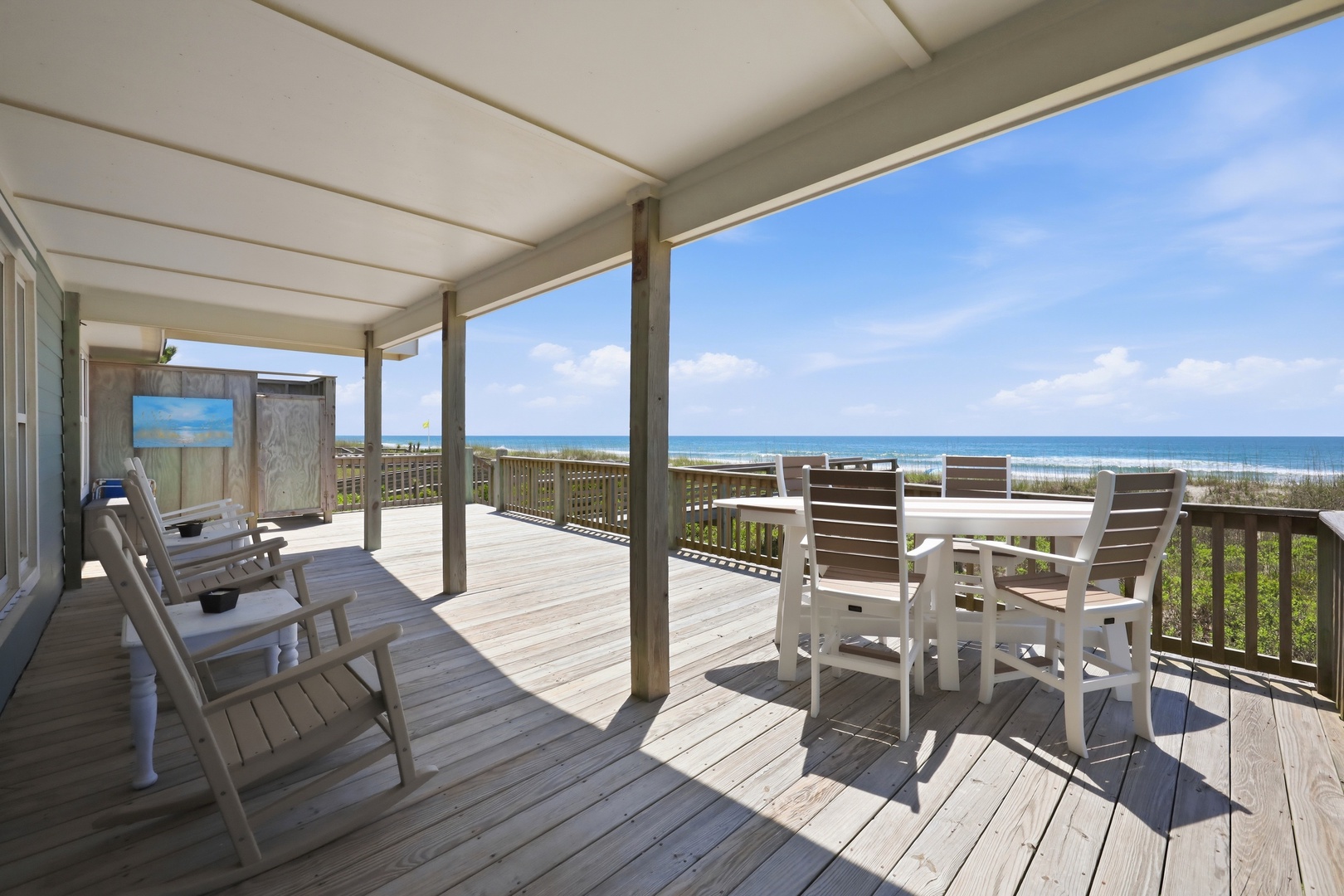Your private oceanfront deck awaits, where gentle sea breezes and endless blue horizons create the perfect backdrop for morning coffee or sunset gatherings with loved ones.
