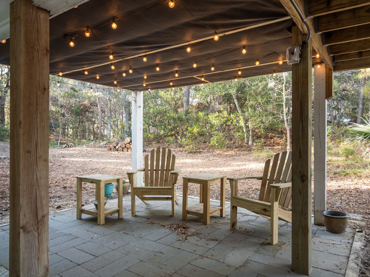 Unwind in your private covered patio where twinkling string lights create the perfect ambiance for evening conversations and peaceful mornings.