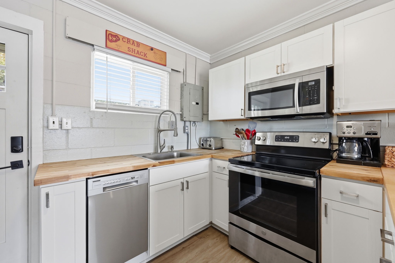 Your fully equipped kitchen features modern appliances and warm wood countertops, making it easy to whip up delicious meals during your stay.