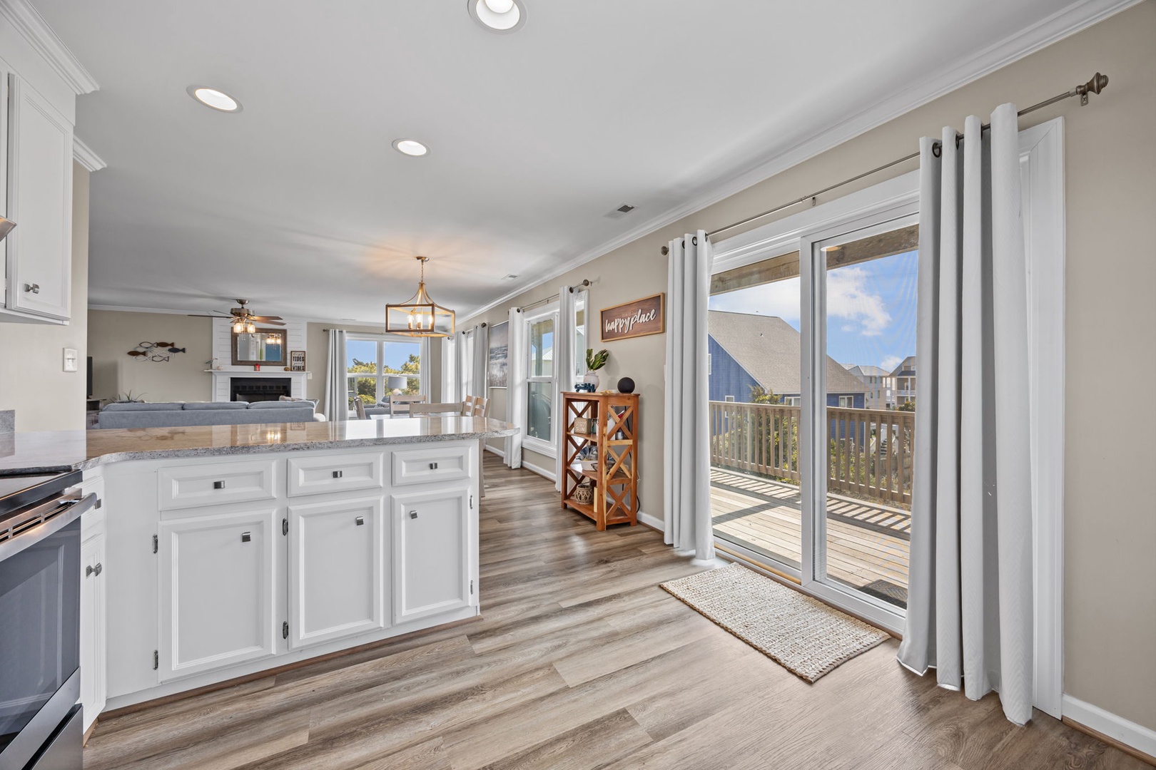 Your bright, airy kitchen flows seamlessly to a private deck where you'll savor morning coffee with stunning views.