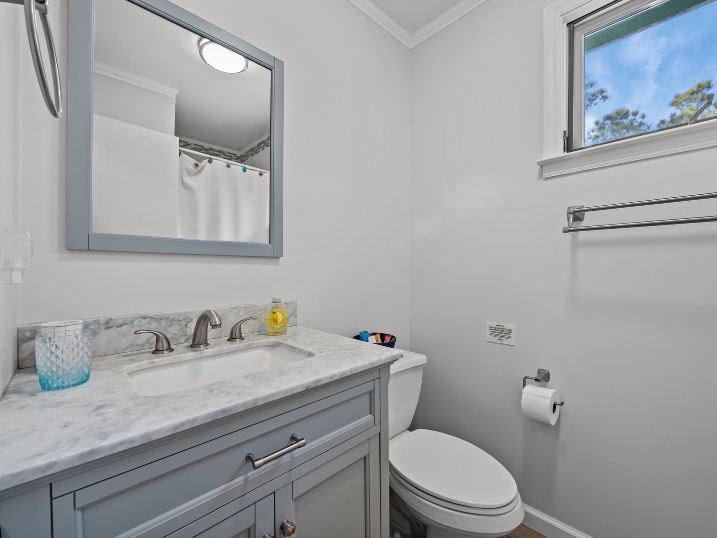 Refresh in your beautifully appointed bathroom with elegant marble countertops and thoughtful amenities.