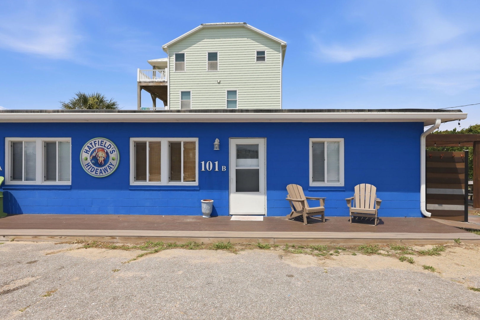 A charming beachfront rental with a welcoming front deck, two Adirondack chairs, and direct access to sandy shores. The property includes convenient parking right at your doorstep.