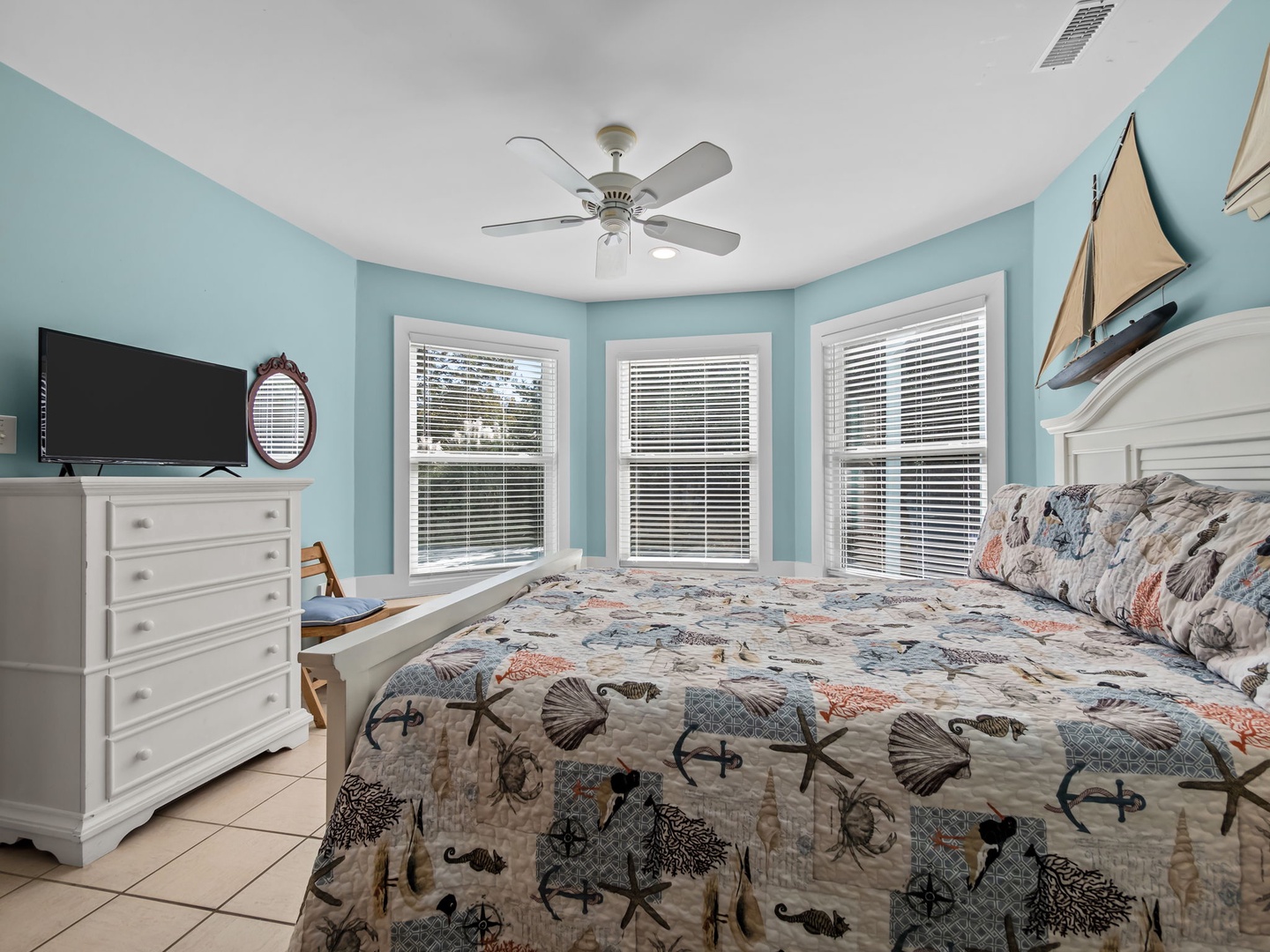 Drift to sleep in your coastal-themed bedroom with soothing ocean colors and charming nautical bedding.