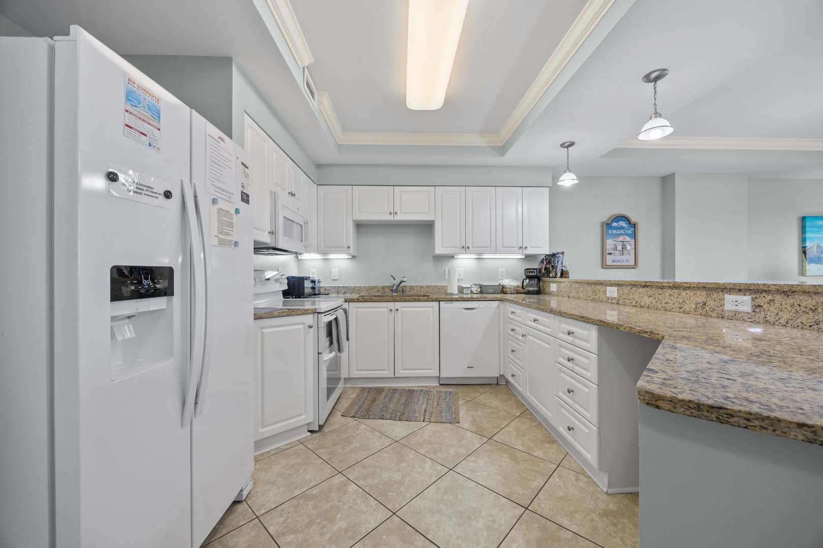 Your fully equipped kitchen awaits with granite counters, modern appliances, and everything you need to create memorable meals together.