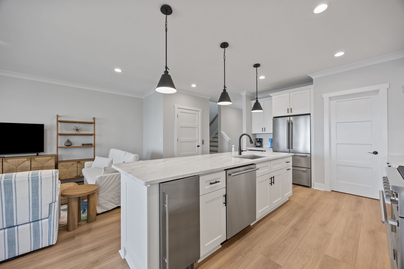 Your open-plan kitchen flows seamlessly into the living area, creating the perfect space for cooking and connecting with loved ones.