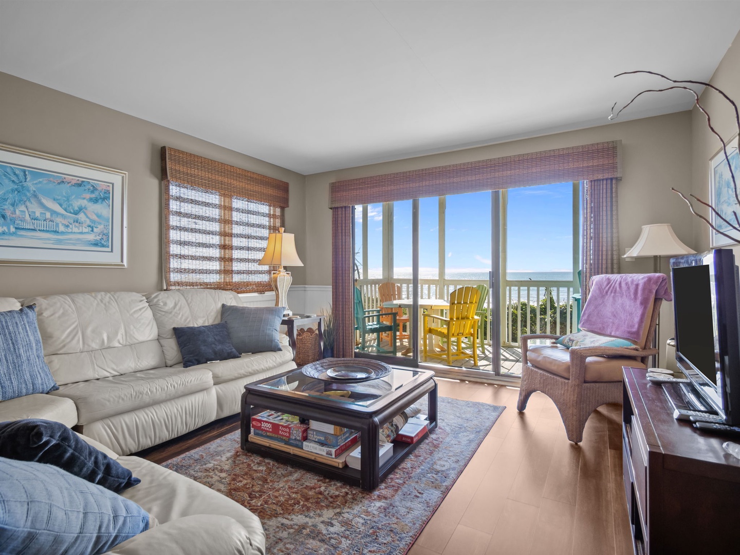 Sink into comfortable seating while ocean breezes flow through your private balcony doors, creating the perfect coastal retreat.