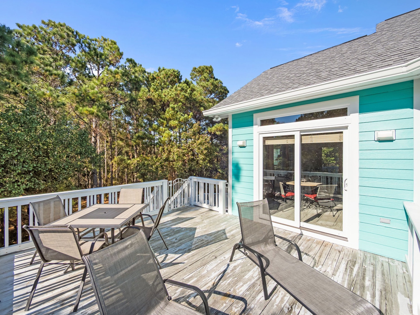 Step onto your private deck where forest views and coastal breezes create the perfect backdrop for morning coffee or evening relaxation.