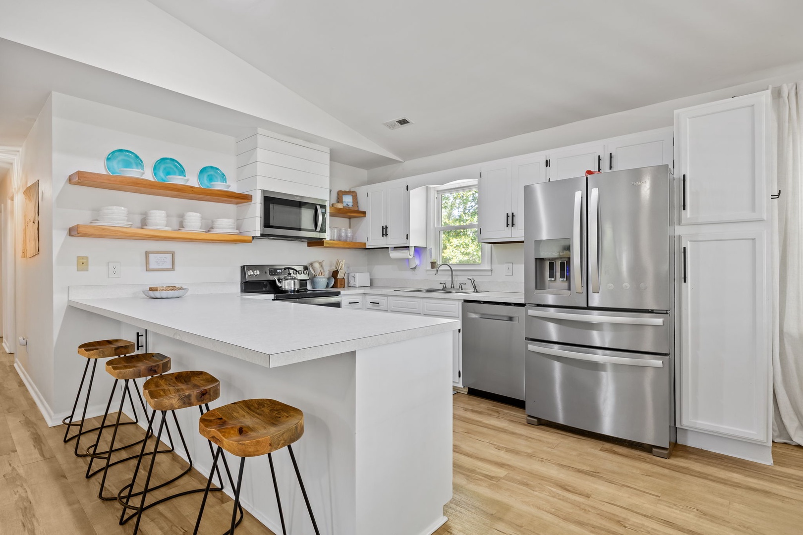 Your fully equipped kitchen features stainless steel appliances, granite countertops, and a breakfast bar where you can start each morning with coffee.
