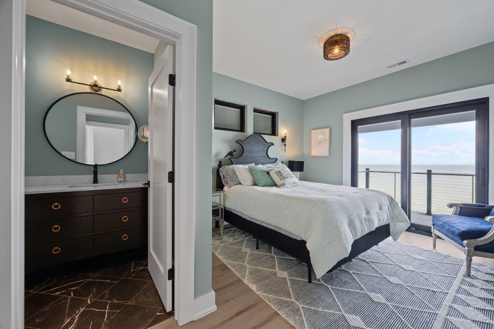 Drift off in this serene bedroom where coastal colors meet modern comfort, your private balcony opening to endless views.