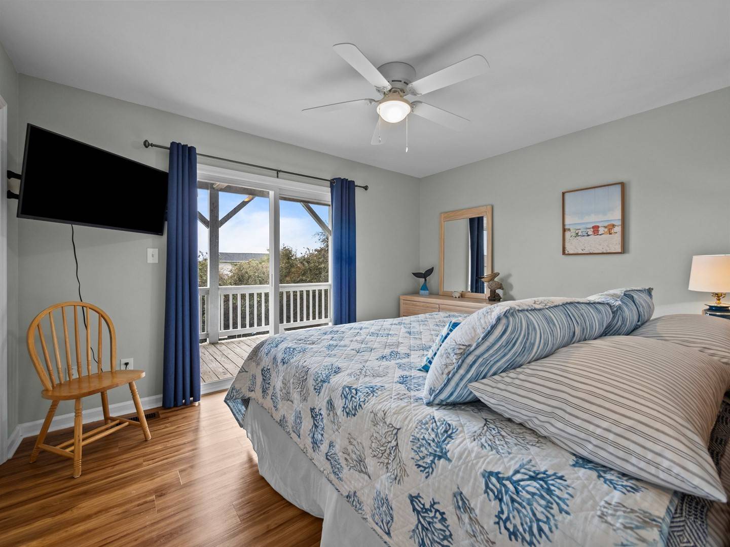 Wake up to gentle breezes from your ceiling fan and peaceful views through French doors leading to your private balcony.