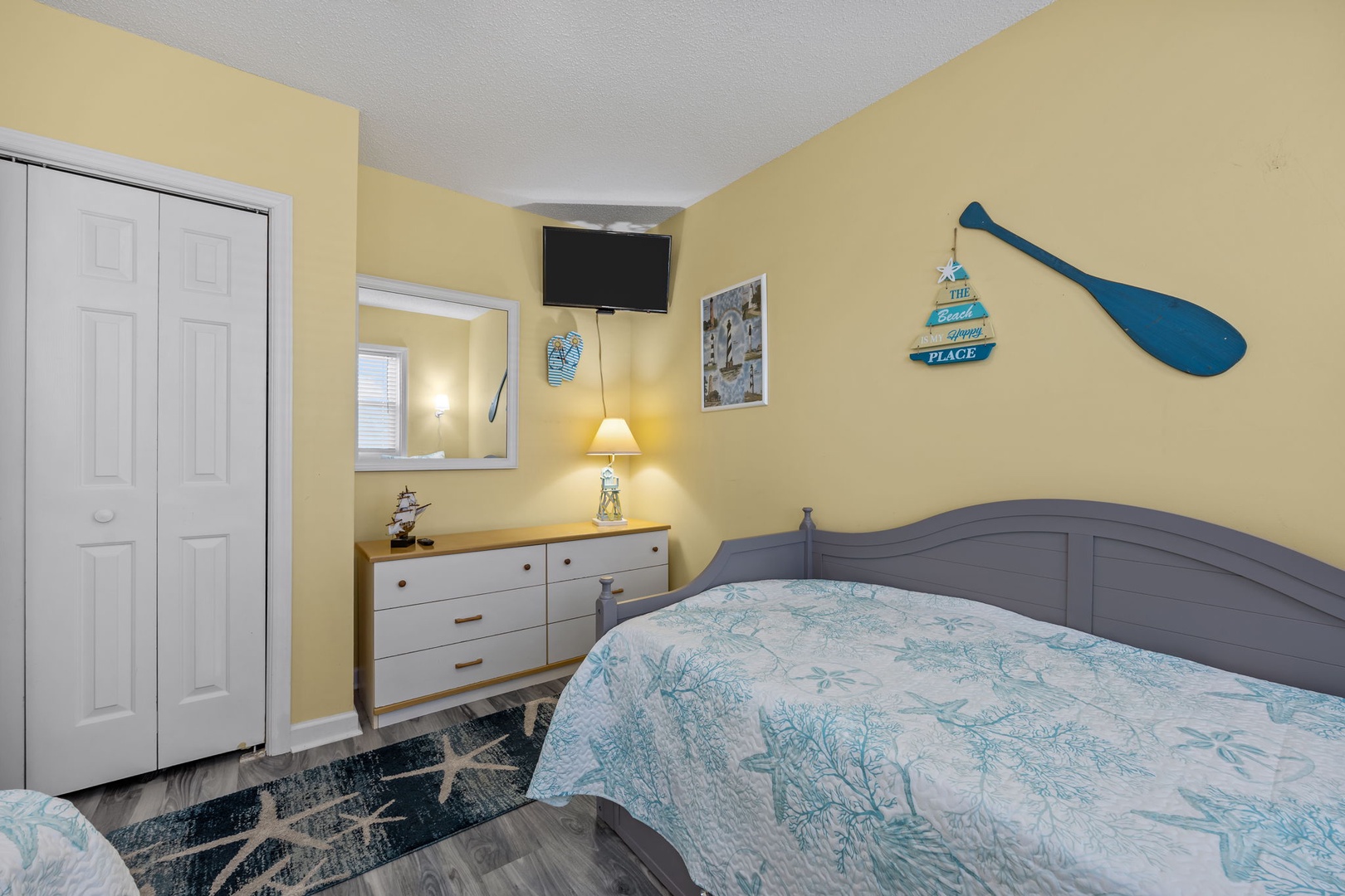 Rest peacefully in your charming coastal-themed bedroom, complete with nautical decor and modern amenities for your perfect beach getaway.