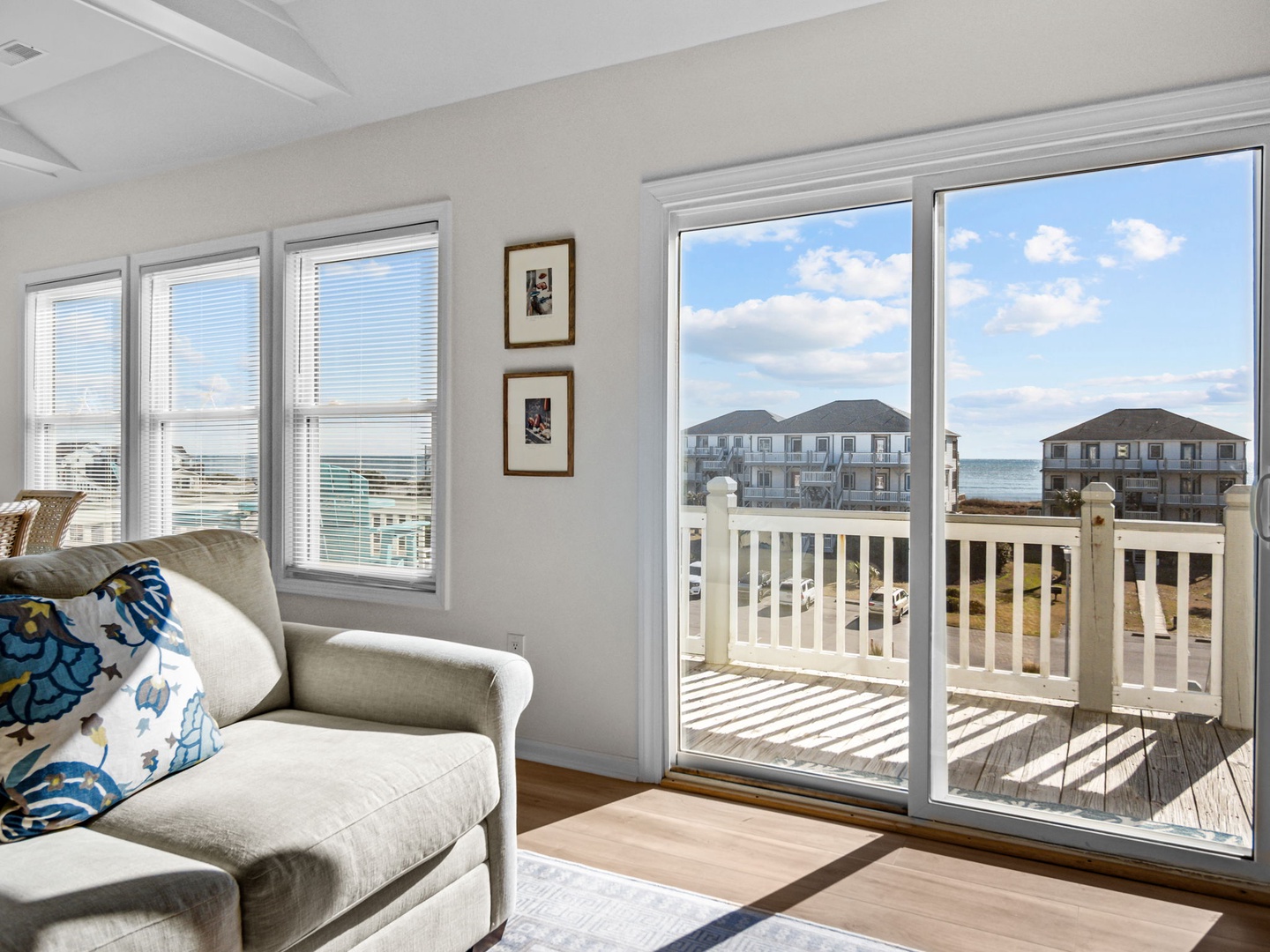 Unwind in your bright living space where natural light floods through large windows, then step onto your private deck to soak in coastal views.